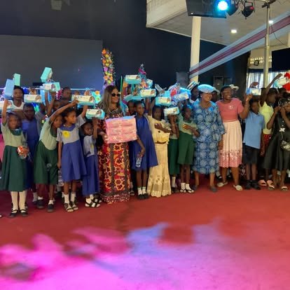 Benjamin Family Initiative outreach participants holding sanitary pads