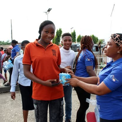 Sanitary pad being handed to a young participant