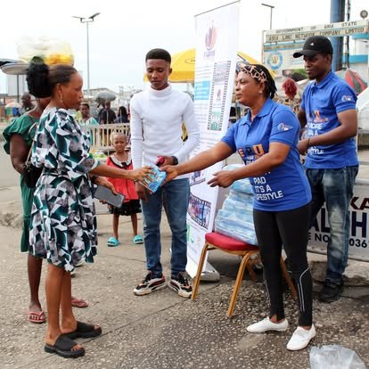Benjamin Family Initiative sanitary-pad distribution to a community member